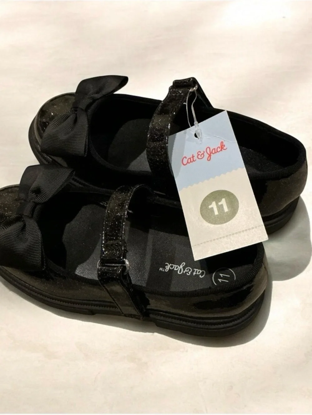 Buy one get one 50% off Cat & Jack Black Glitter Mary Jane Shoes with Bow Accent